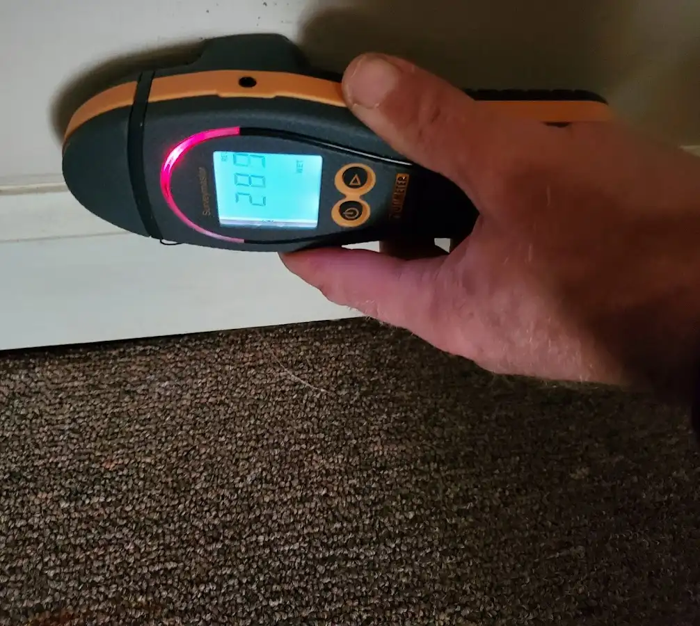 Moisture detection at baseboard during Storm Damage Restoration in Middle Paxton